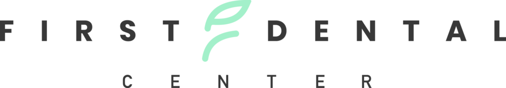 Logo of First Dental Center featuring stylized green leaves and the text 'First Dental Center.